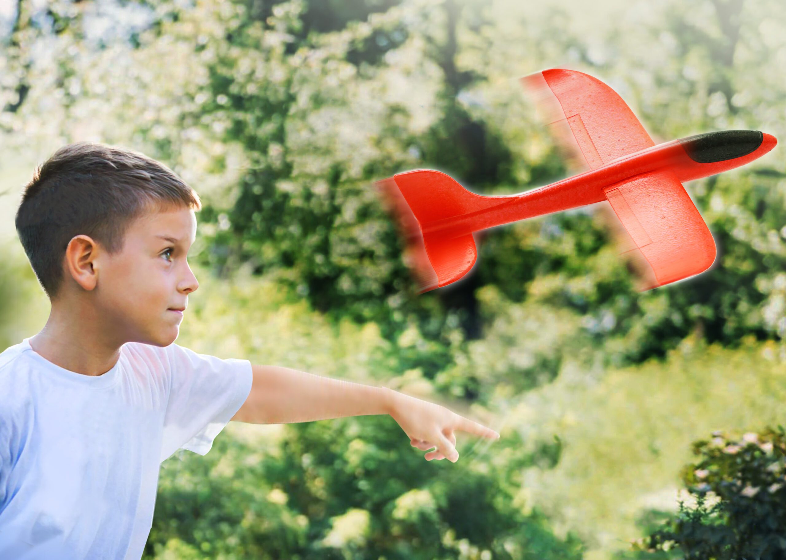 Boy playing with airplane toy